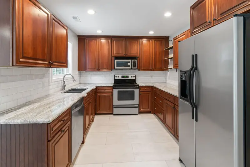 Whole-home interior with wood cabinetry and updated finishes